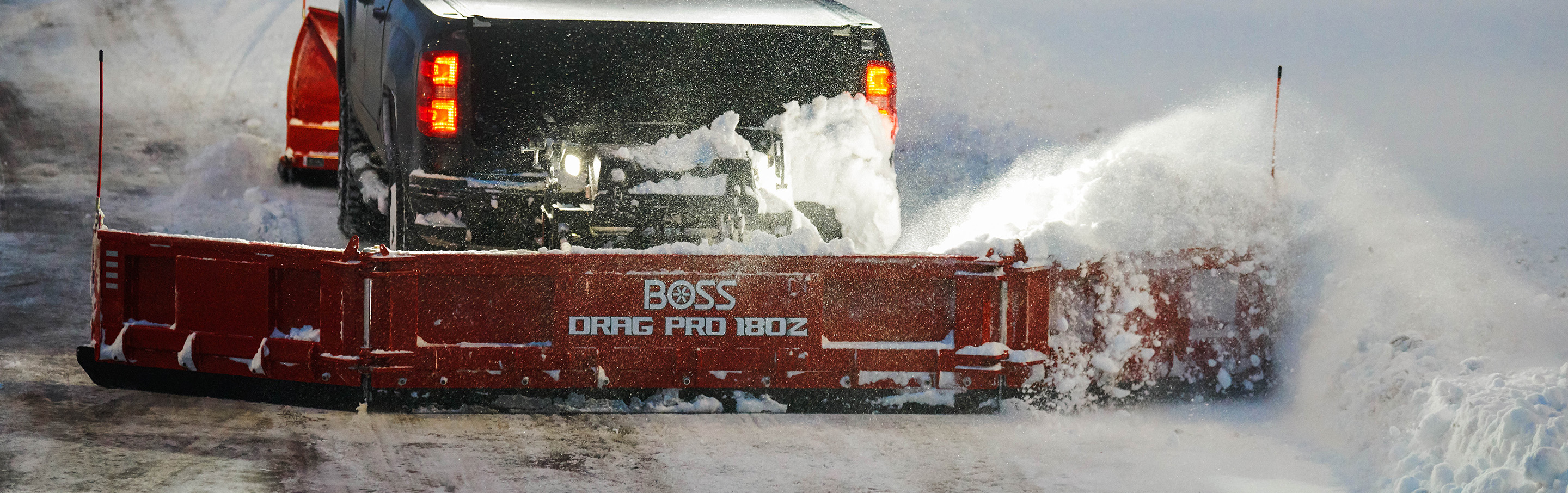Truck dragging snow with a BOSS Drag Pro 180z 
